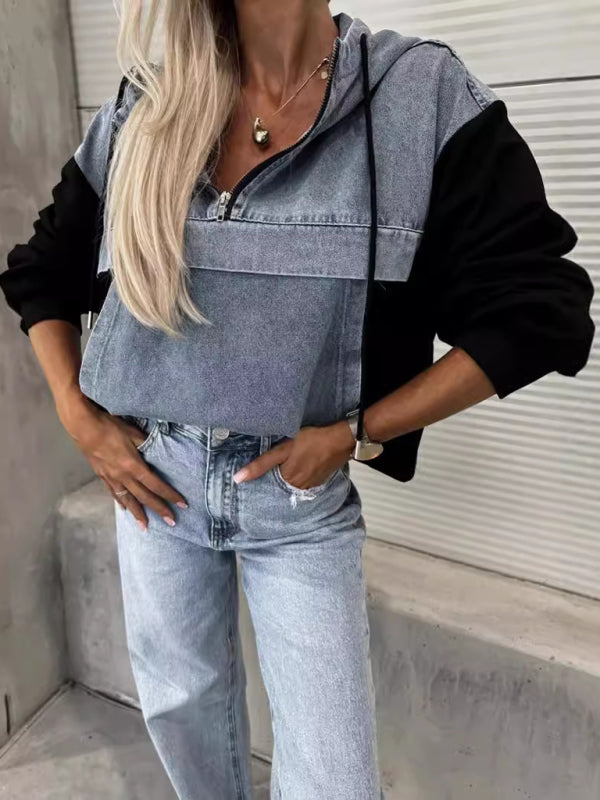 Close-up of denim hooded sweatshirt with black sleeves