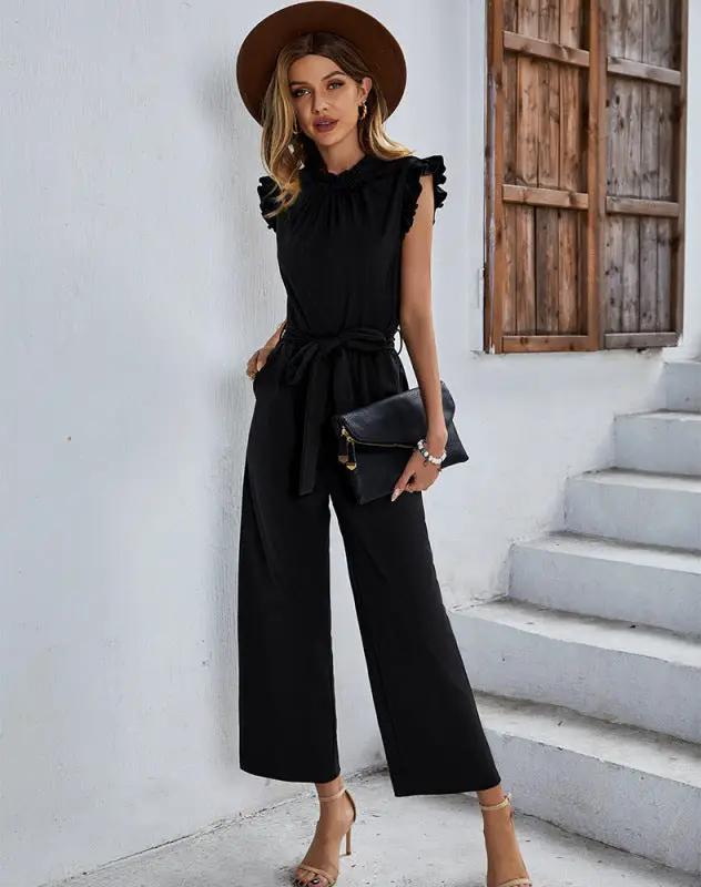 Black sleeveless belted jumpsuit with ruffle details