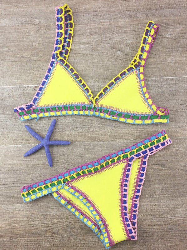 a bikini top and starfish on a wooden floor