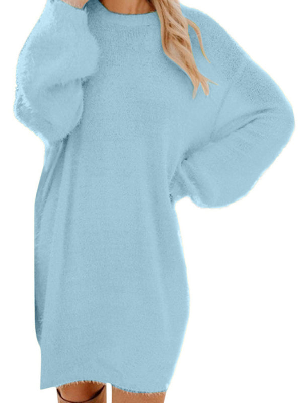 a woman wearing a blue sweater dress
