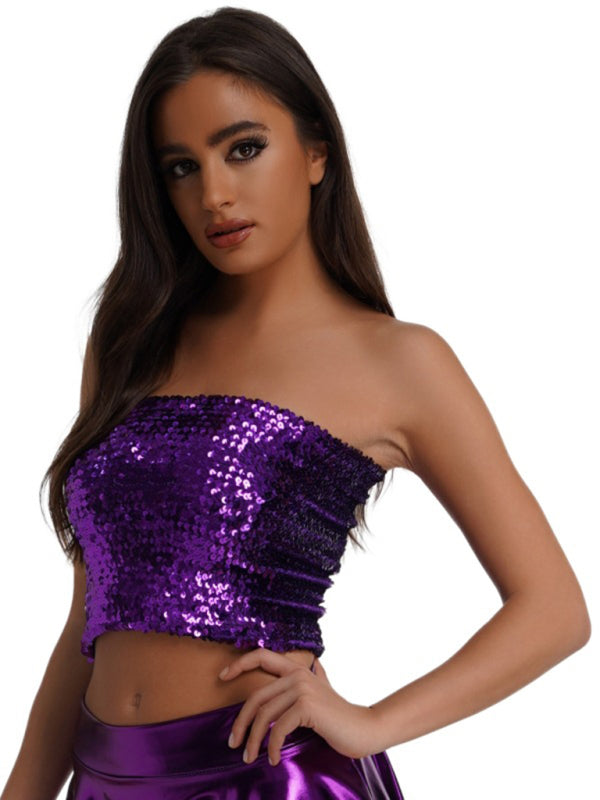 a woman in a purple top and purple skirt
