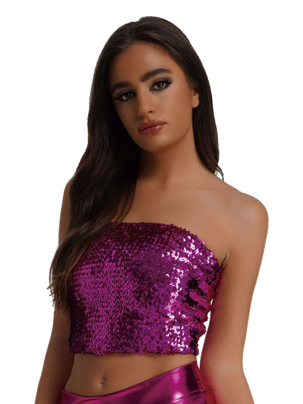a woman wearing a purple top and purple skirt