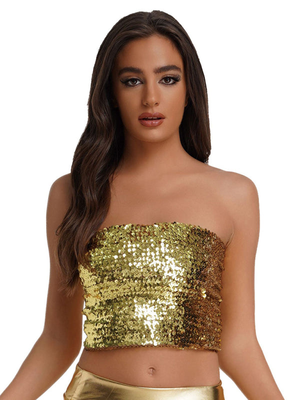 a woman wearing a gold sequin crop top