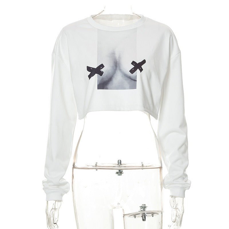 a white crop top with two black birds on it