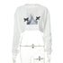 a white crop top with two black birds on it