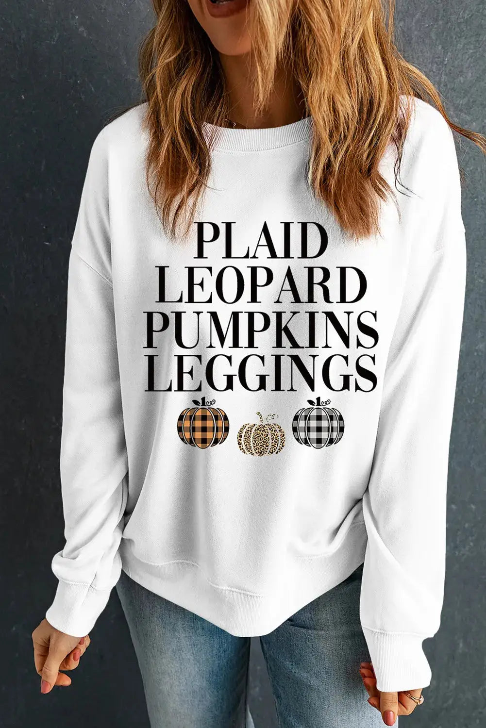 White sweatshirt featuring fall-themed text design.