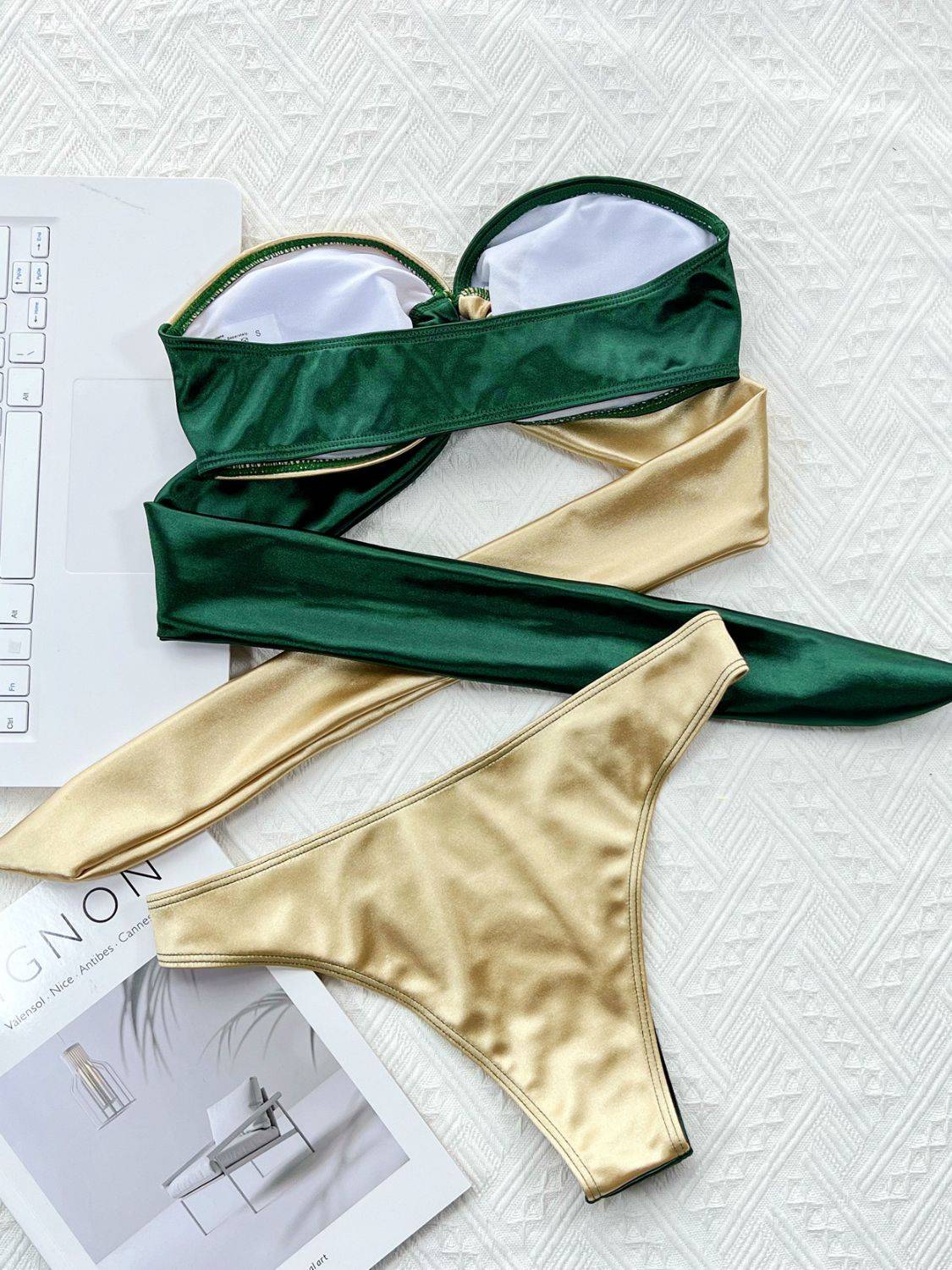 Back view of green and gold bikini set with ring detail