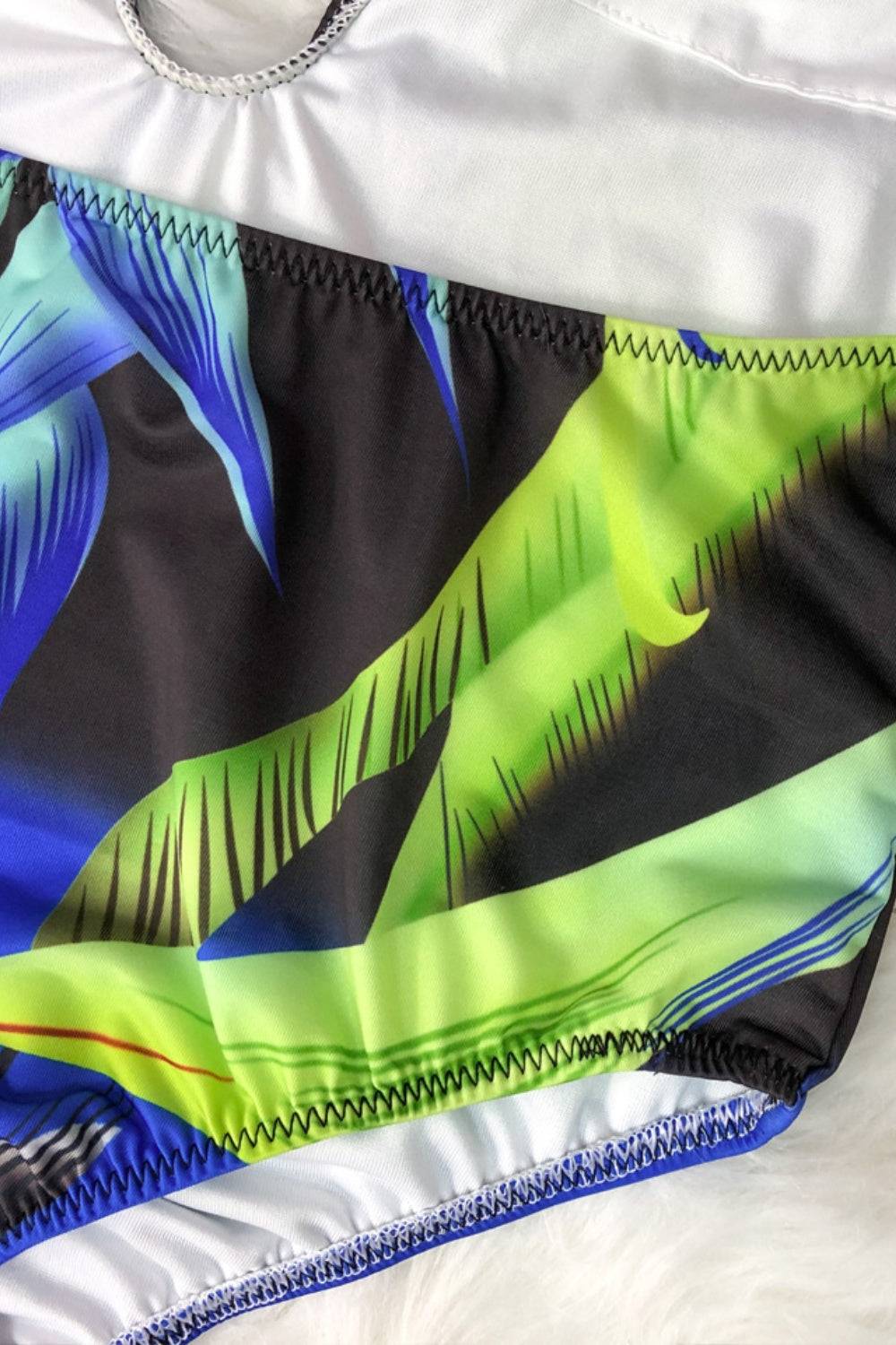 Detailed view of swimsuit with blue and green pattern