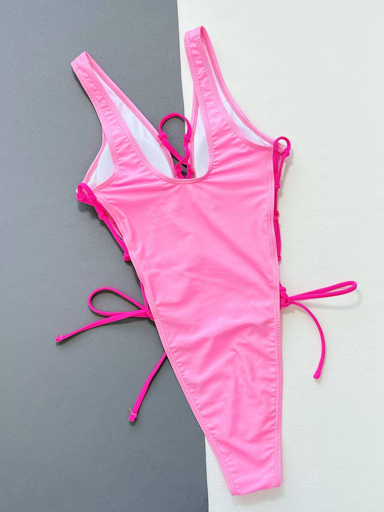 Back view of pink one-piece swimsuit with lace-up sides