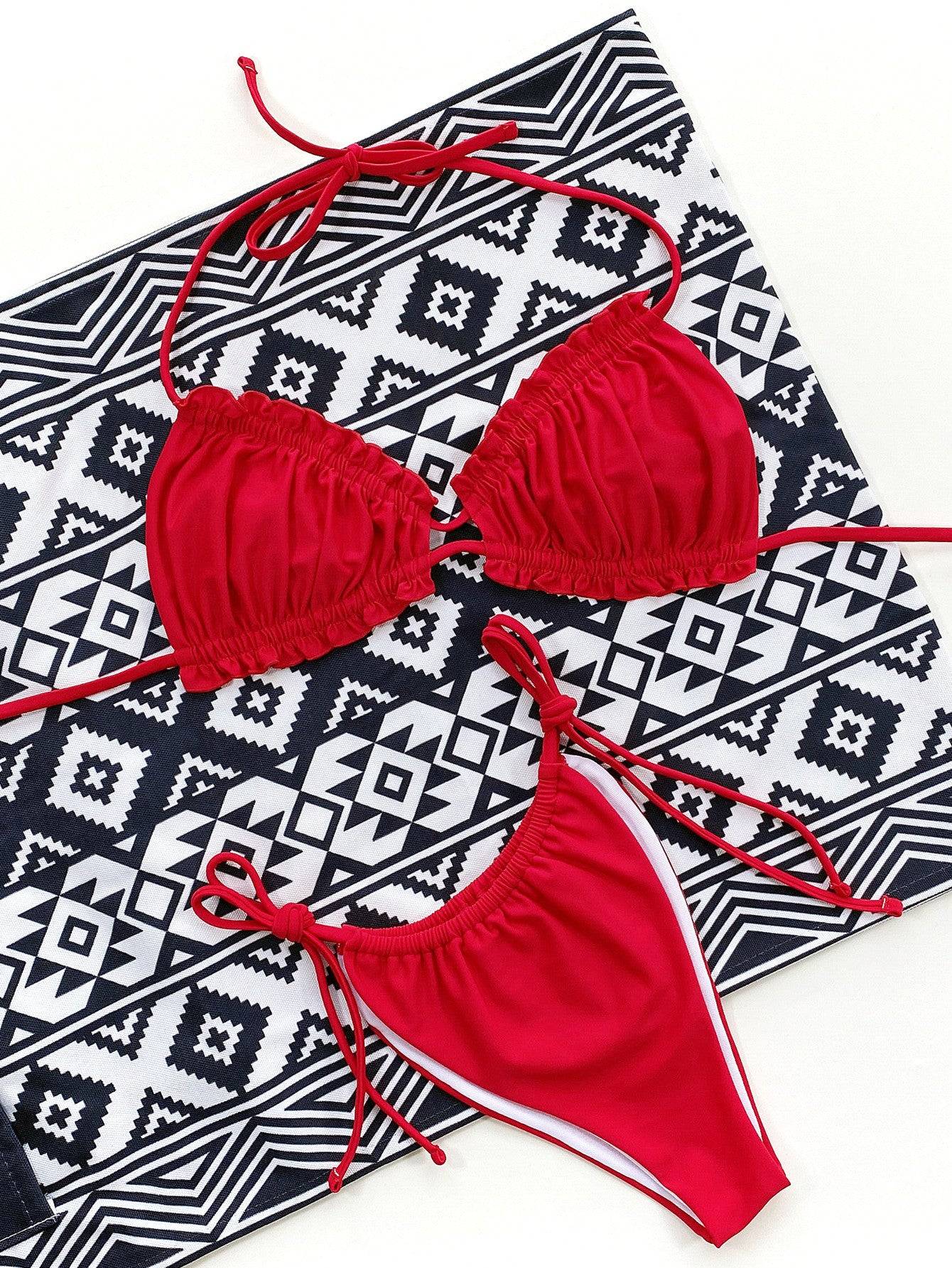 Red bikini set on geometric patterned background