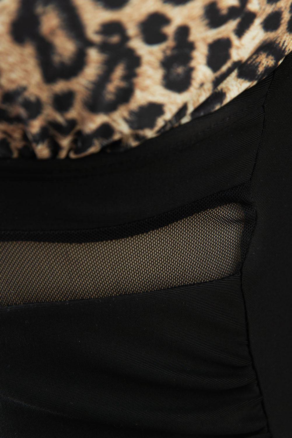 Close-up of leopard print and mesh detail on swimwear