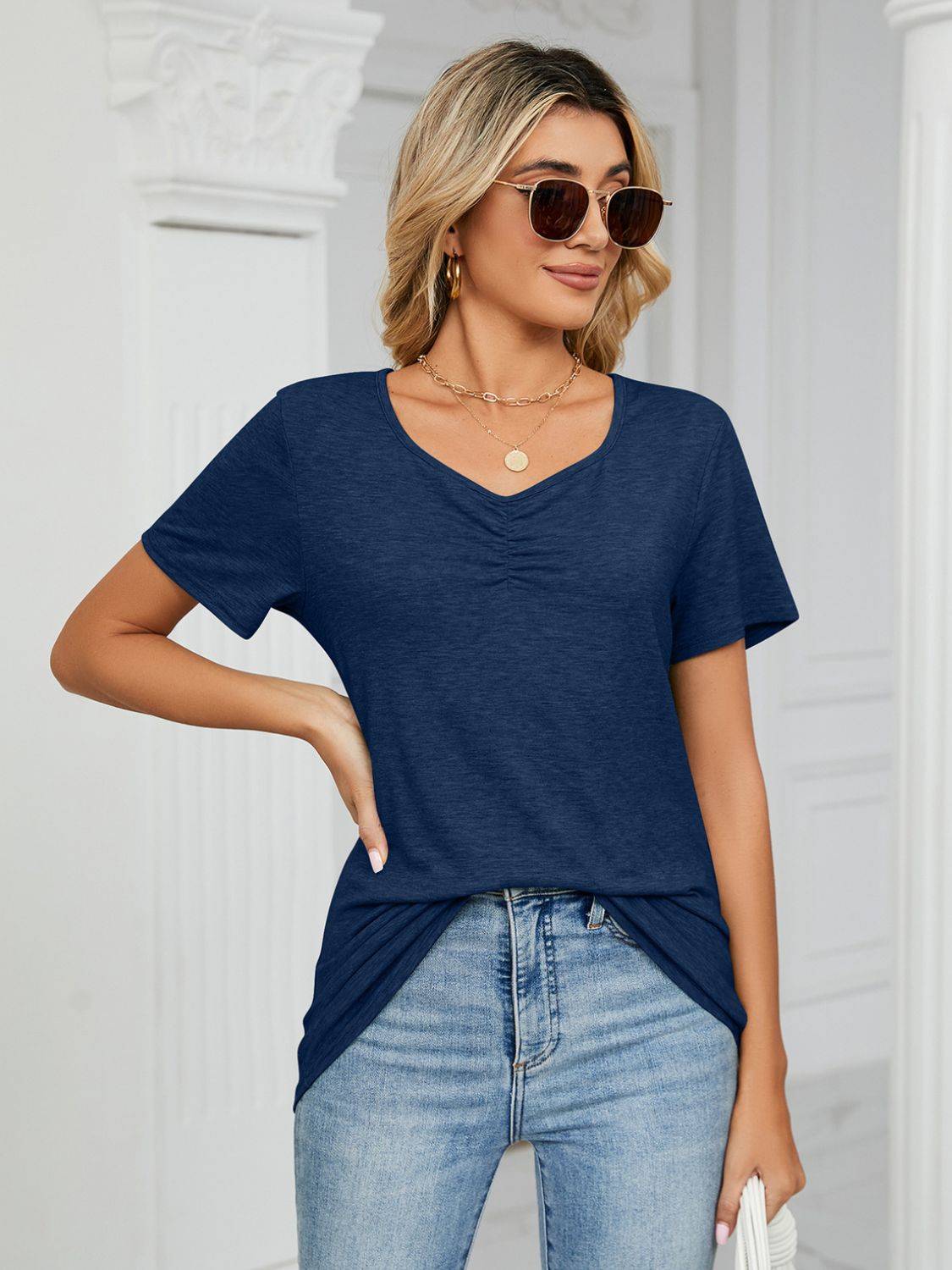 Navy ruched V-neck T-shirt with white bag