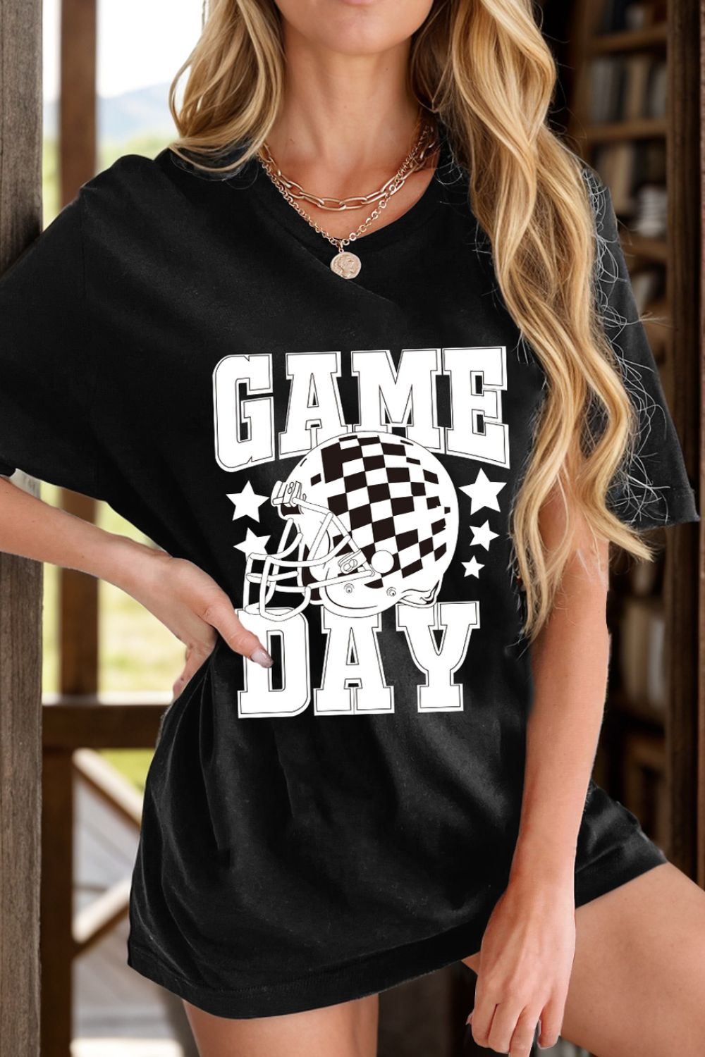 Black GAME DAY T-shirt with helmet graphic, front view