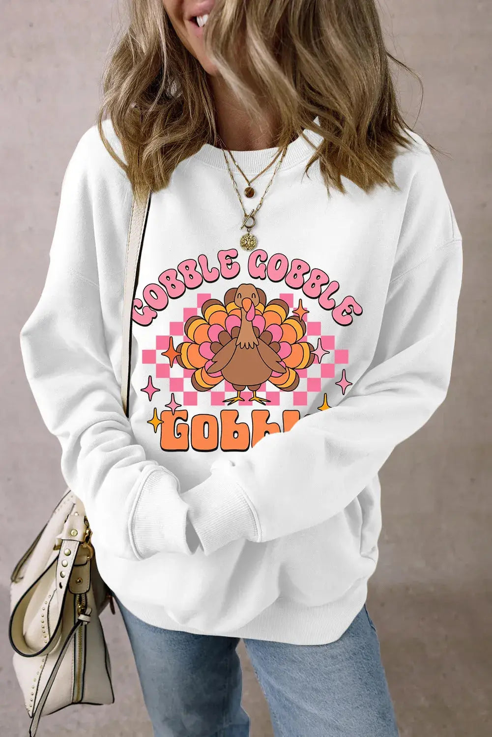 White sweatshirt with turkey graphic and &