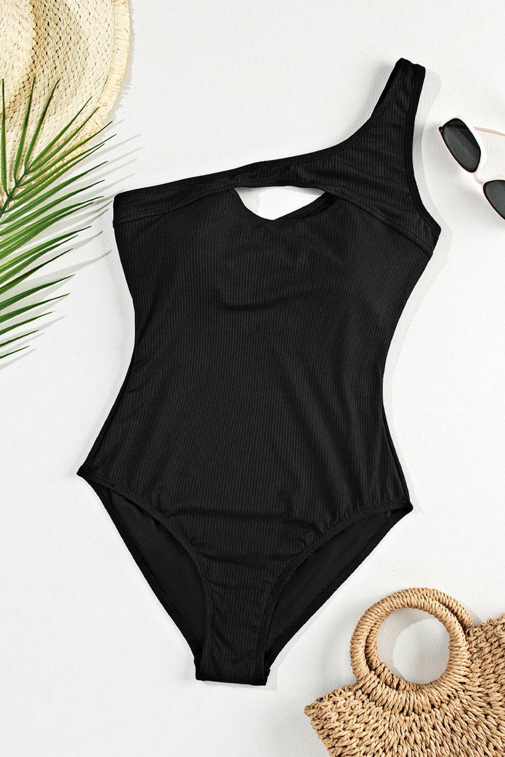 Flat lay of black one shoulder cutout one-piece swimwear