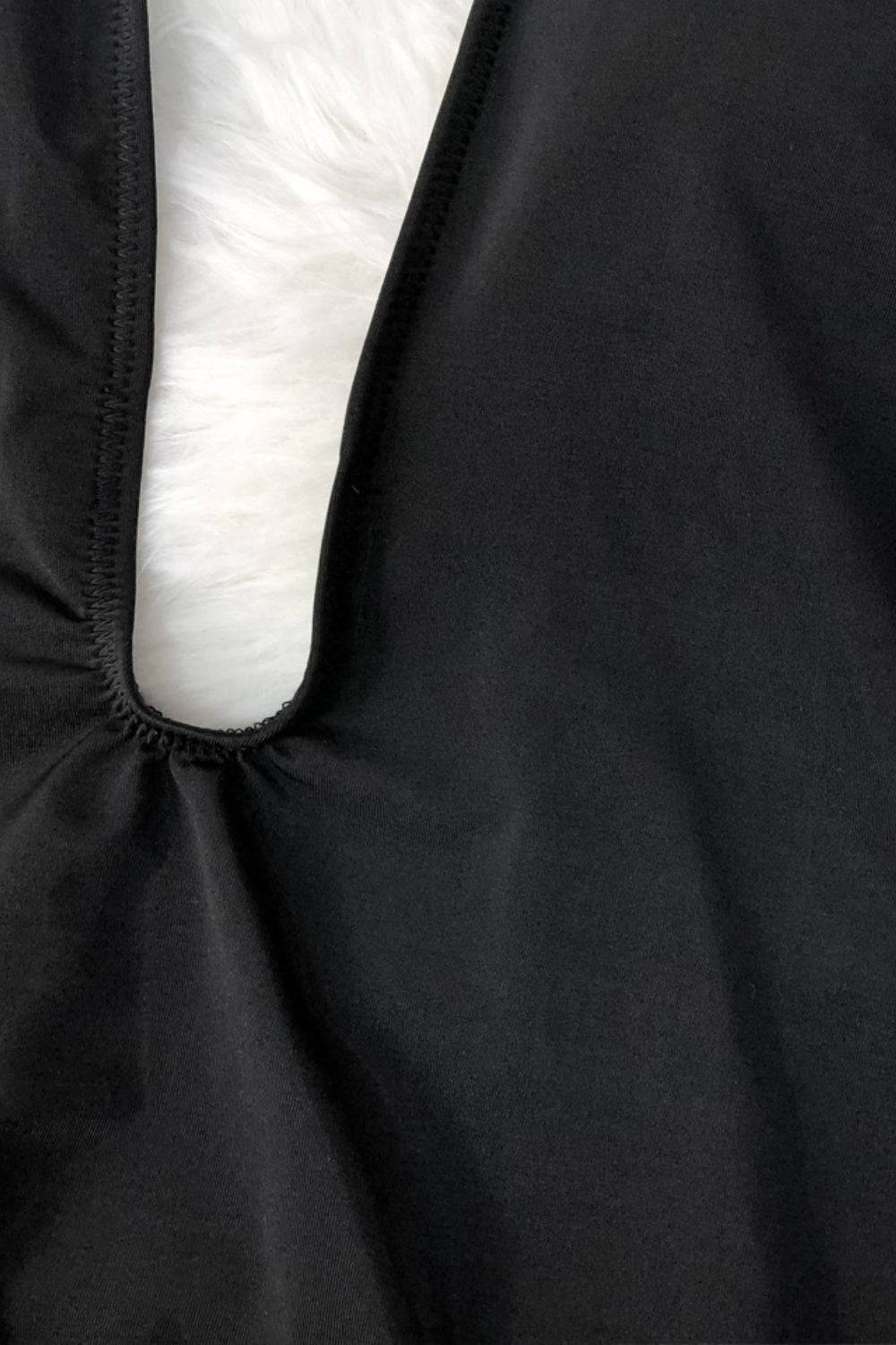 Close-up of black swimsuit fabric and stitching