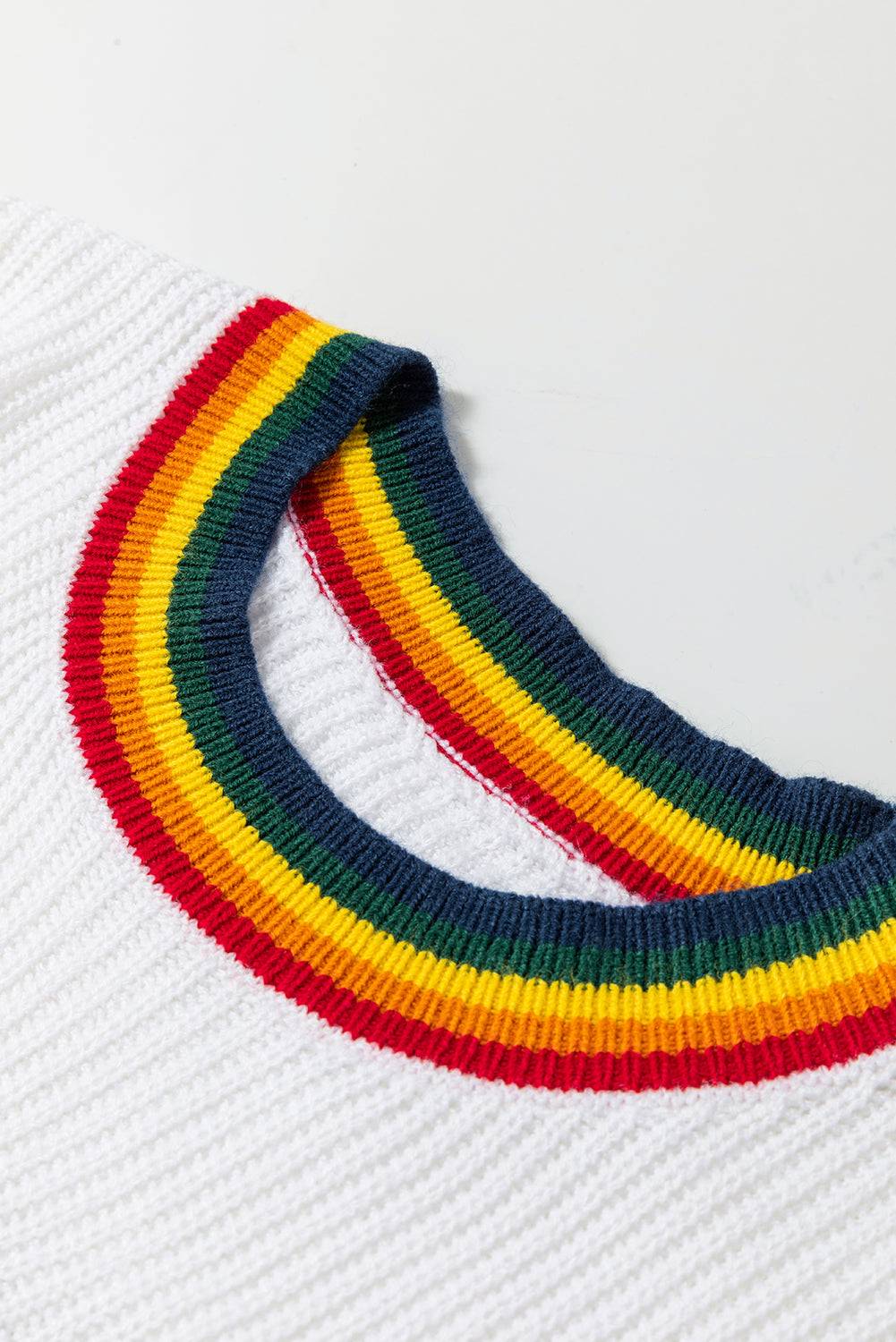 Close-up of white sweater neckline with rainbow trim