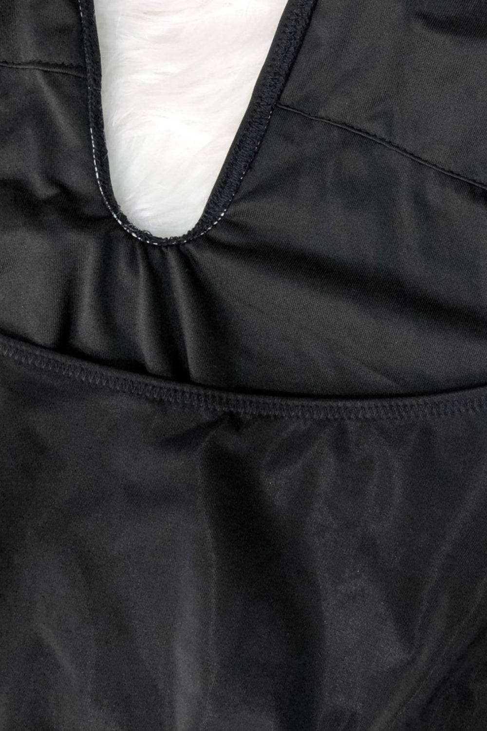 Detail of black swimsuit fabric and seam