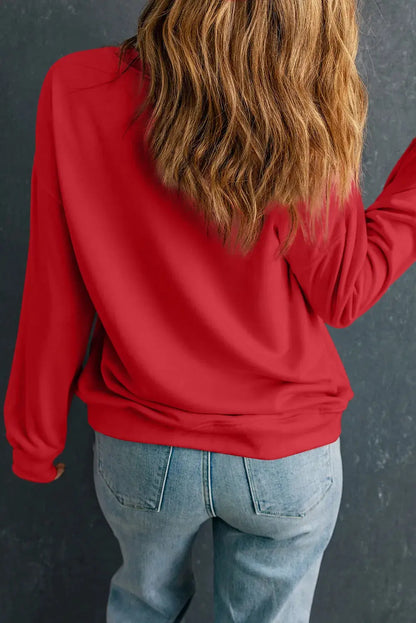 Back view of red long sleeve sweatshirt, casual fit.