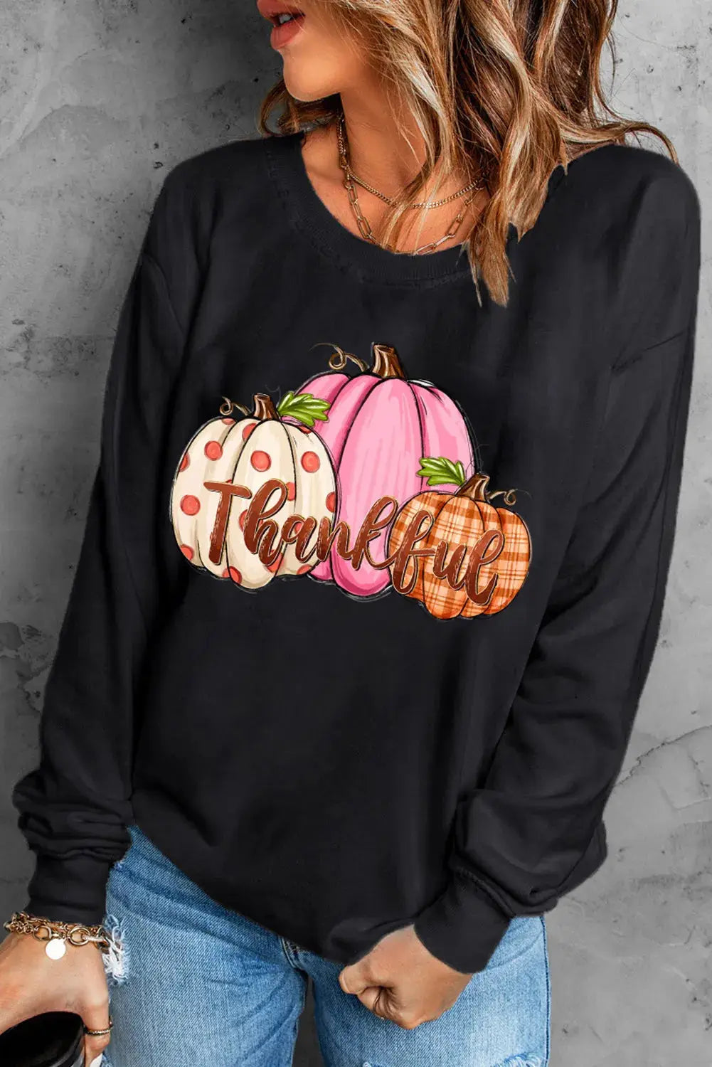 Black sweatshirt with pumpkin graphic and &