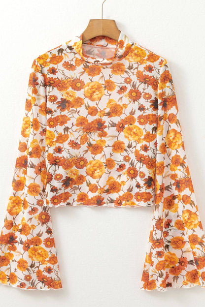 Floral mock neck flare sleeve top on hanger