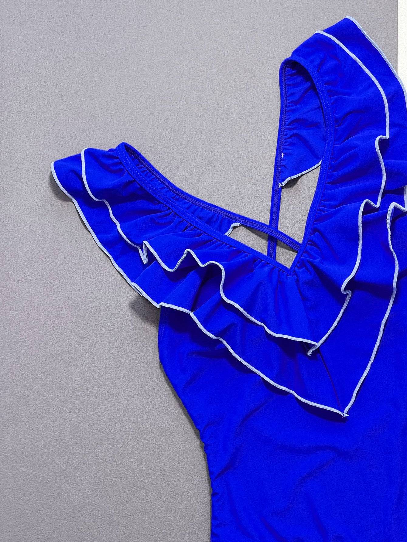 Close-up of blue ruffled crisscross swimsuit details