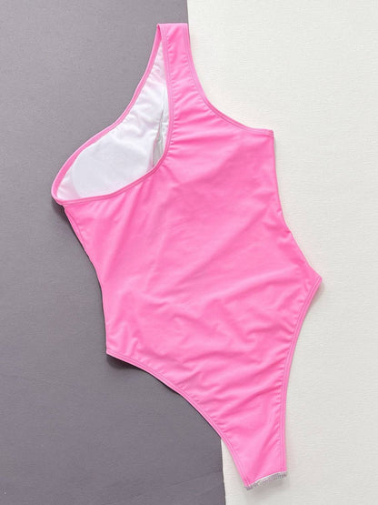 Pink one-piece swimsuit flat lay