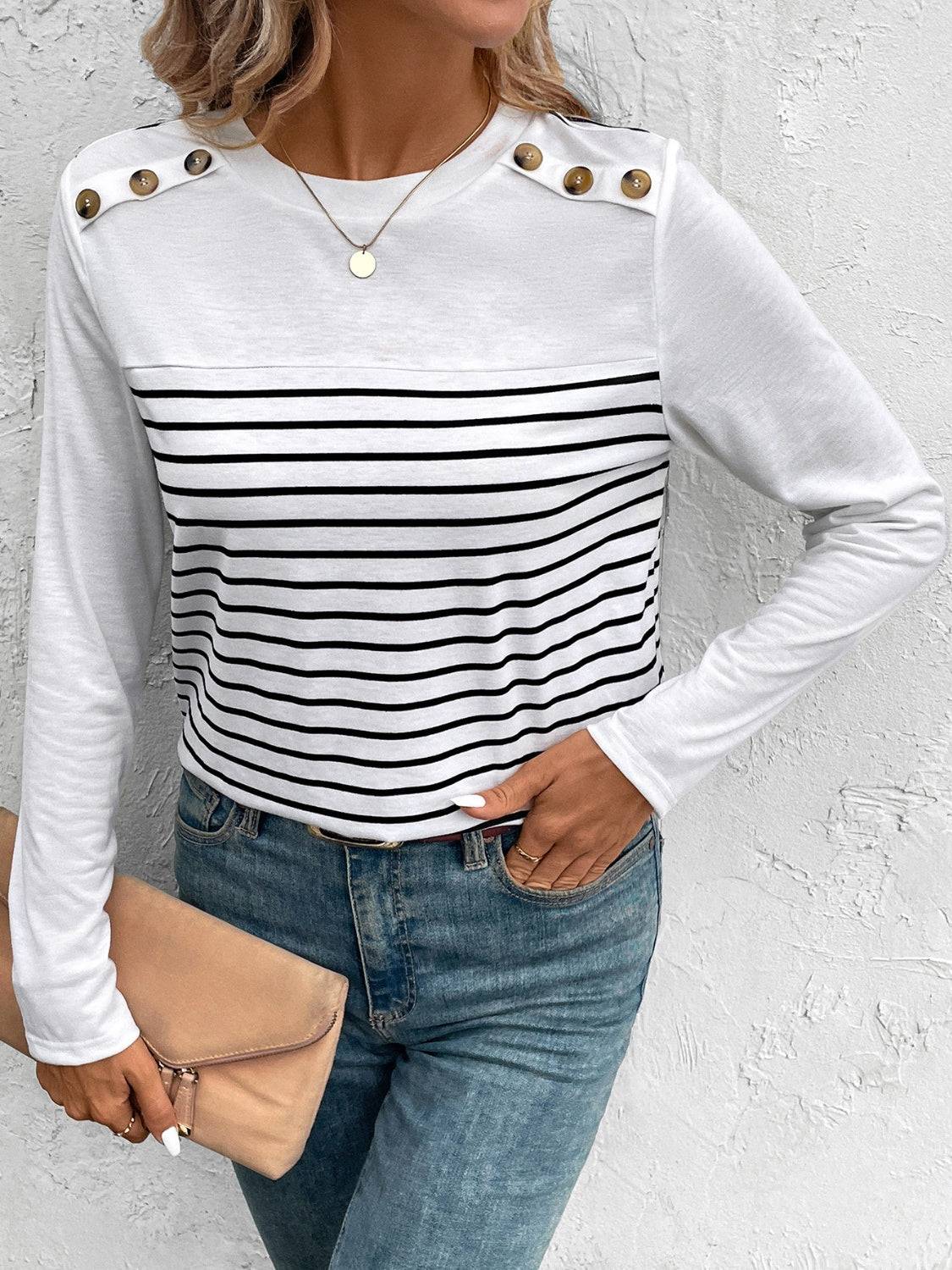 Stylish striped T-shirt with button details on shoulders.