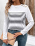 Striped round neck long sleeve T-shirt with decorative buttons.