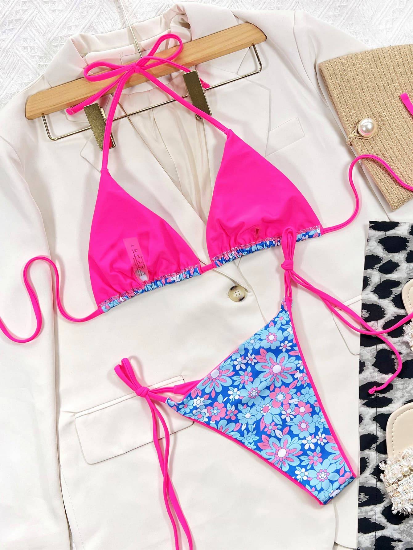 Reversible floral and solid pink bikini set on display