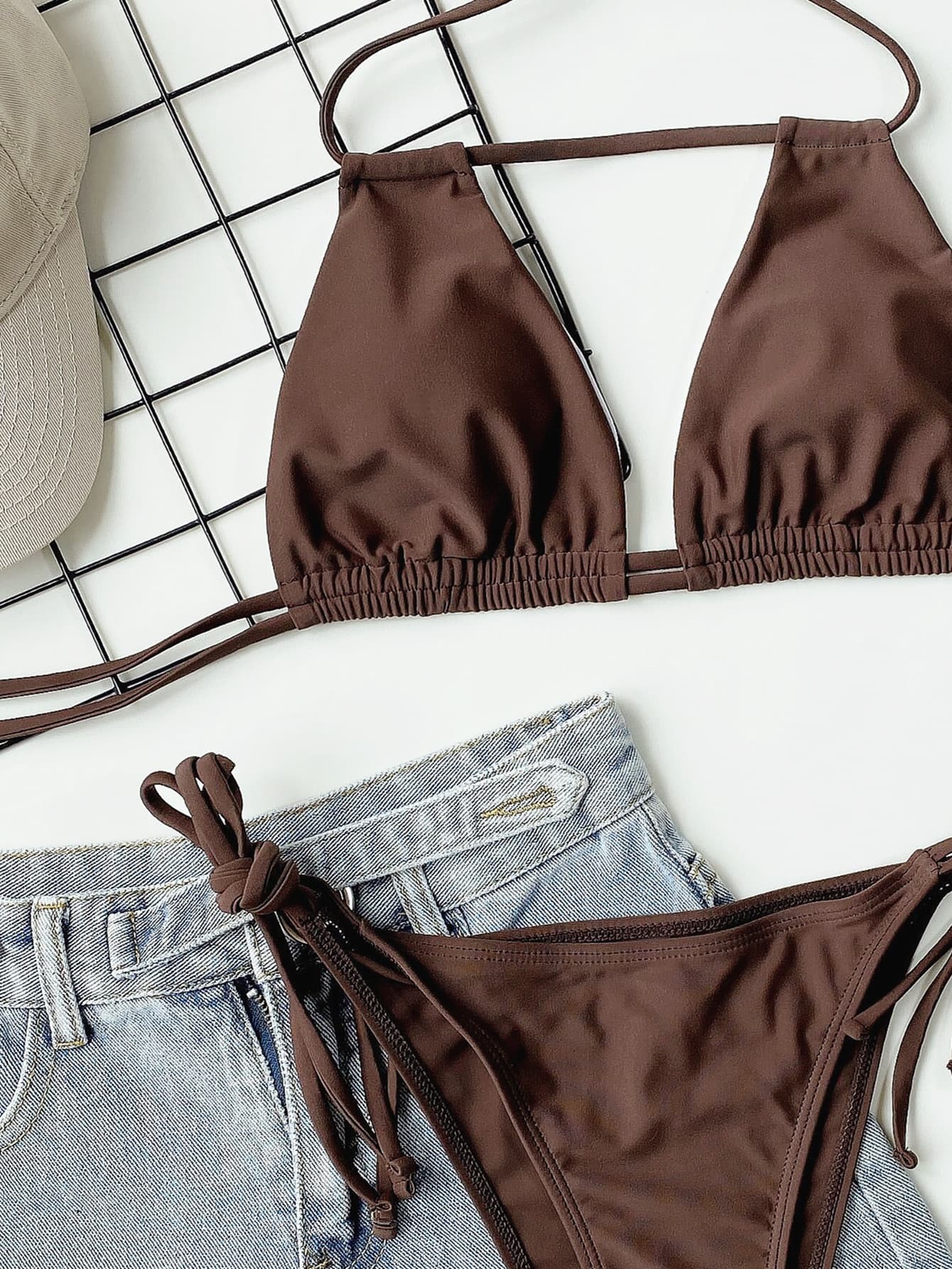 Brown halter neck ruched bikini set displayed with cap