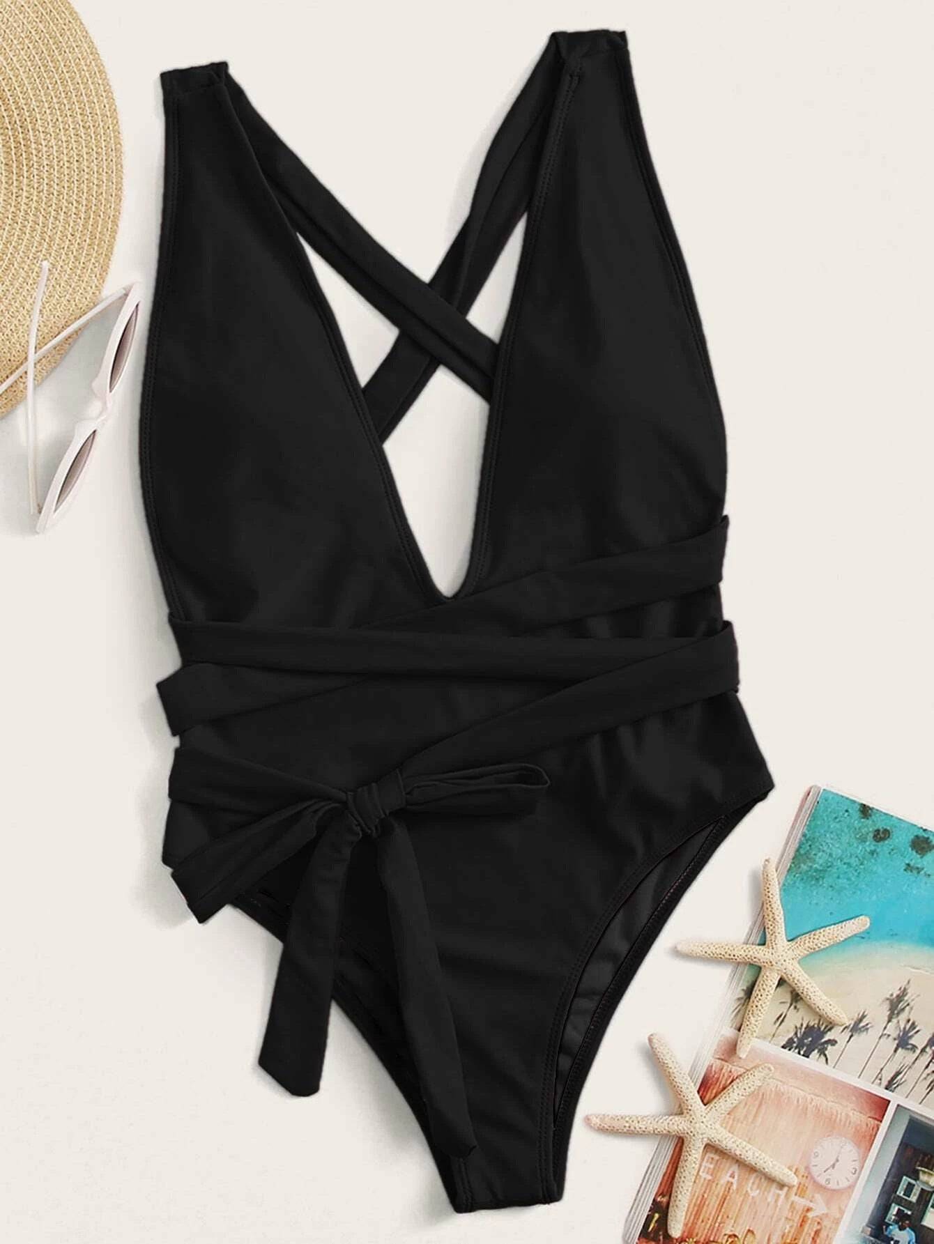 Flat lay of black tied one-piece swimsuit