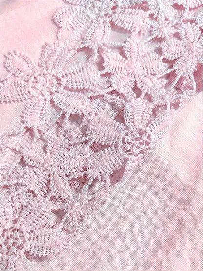 Close-up of lace details on pink long sleeve t-shirt