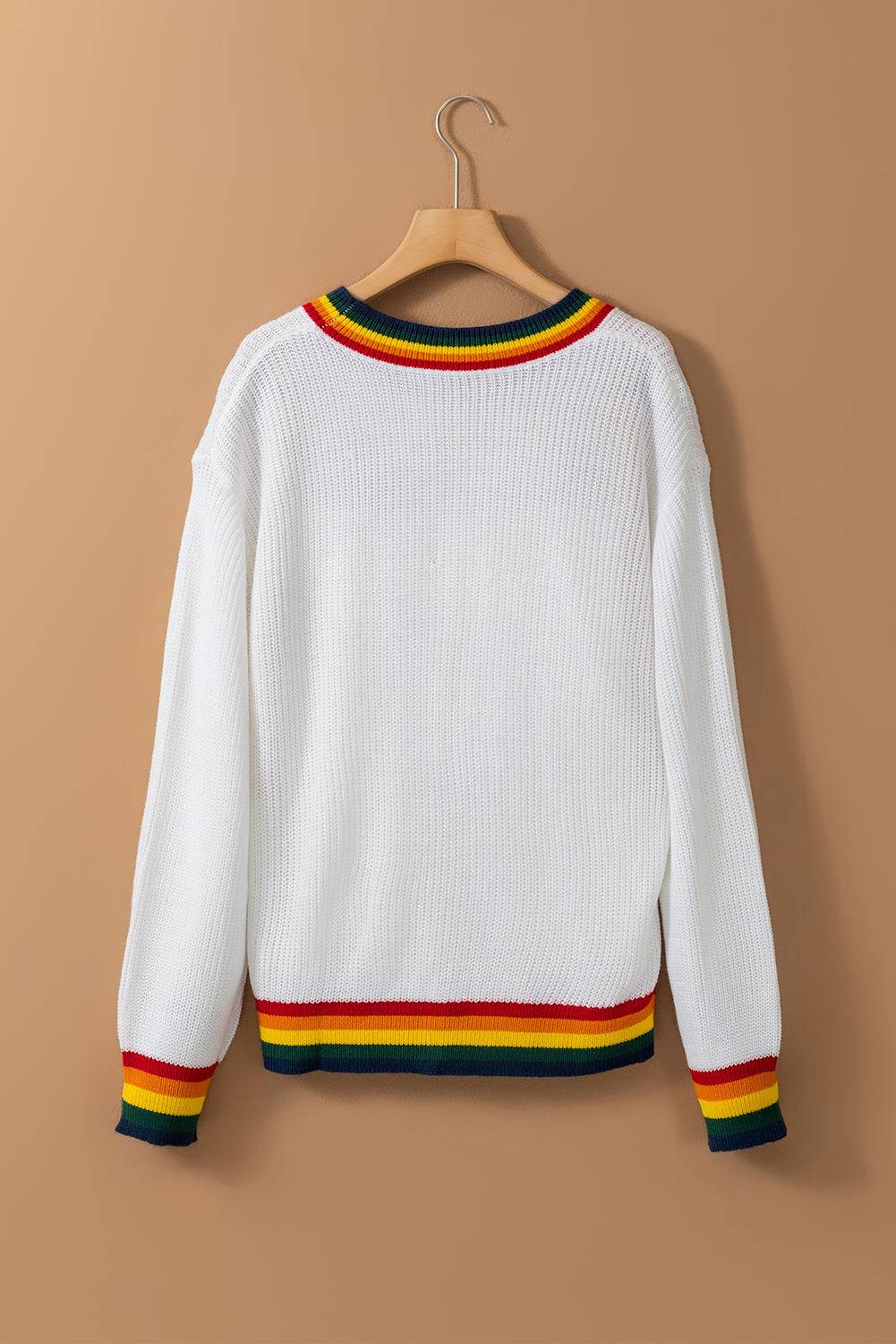 Back view of white sweater with rainbow trim