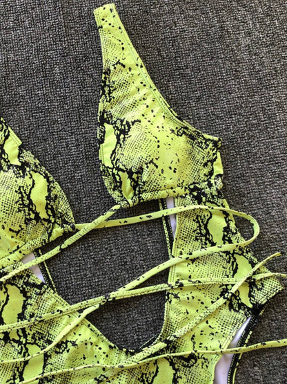 Close-up of green snake print swimwear details