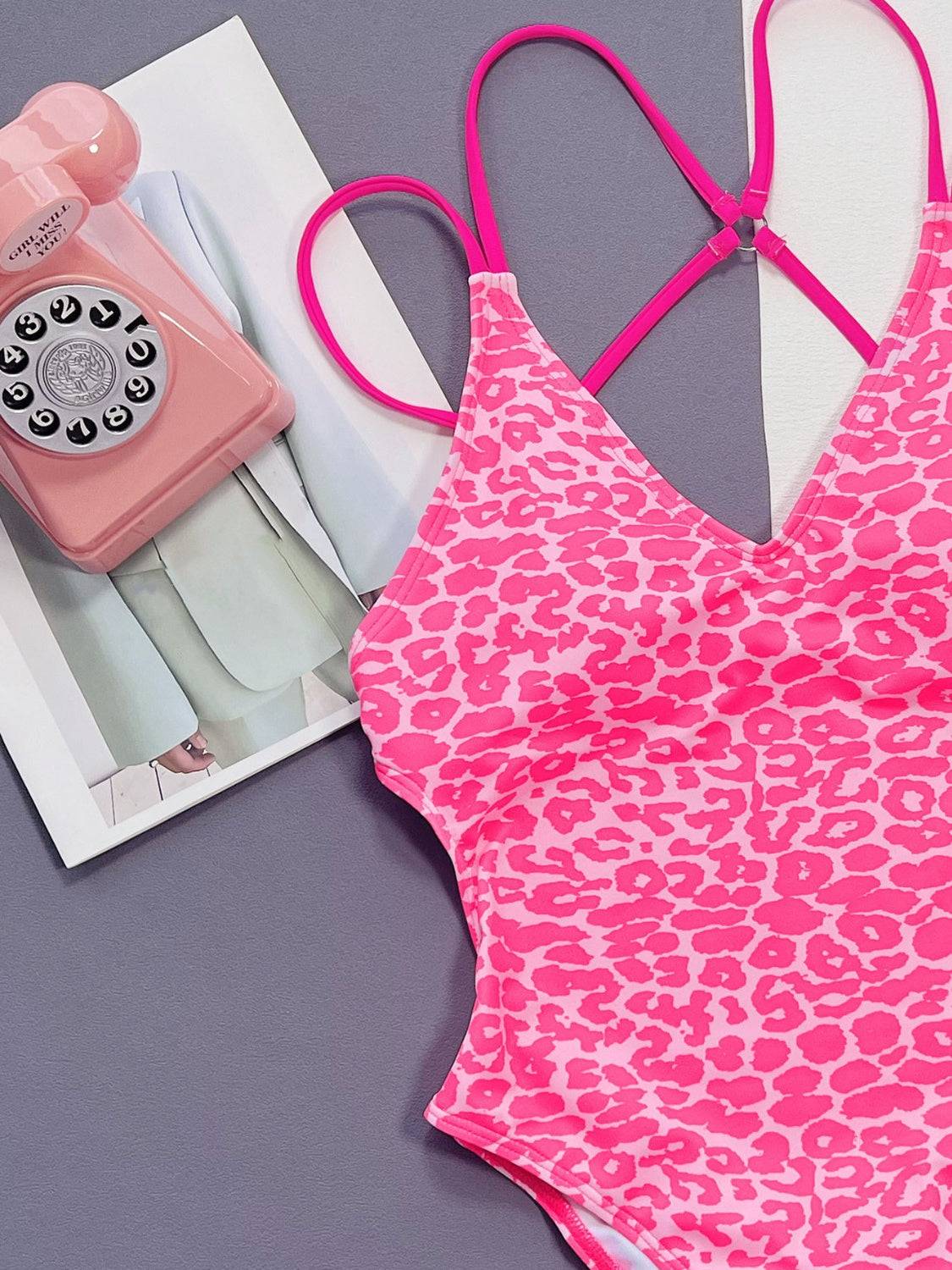 Close-up of pink leopard swimwear with accessories