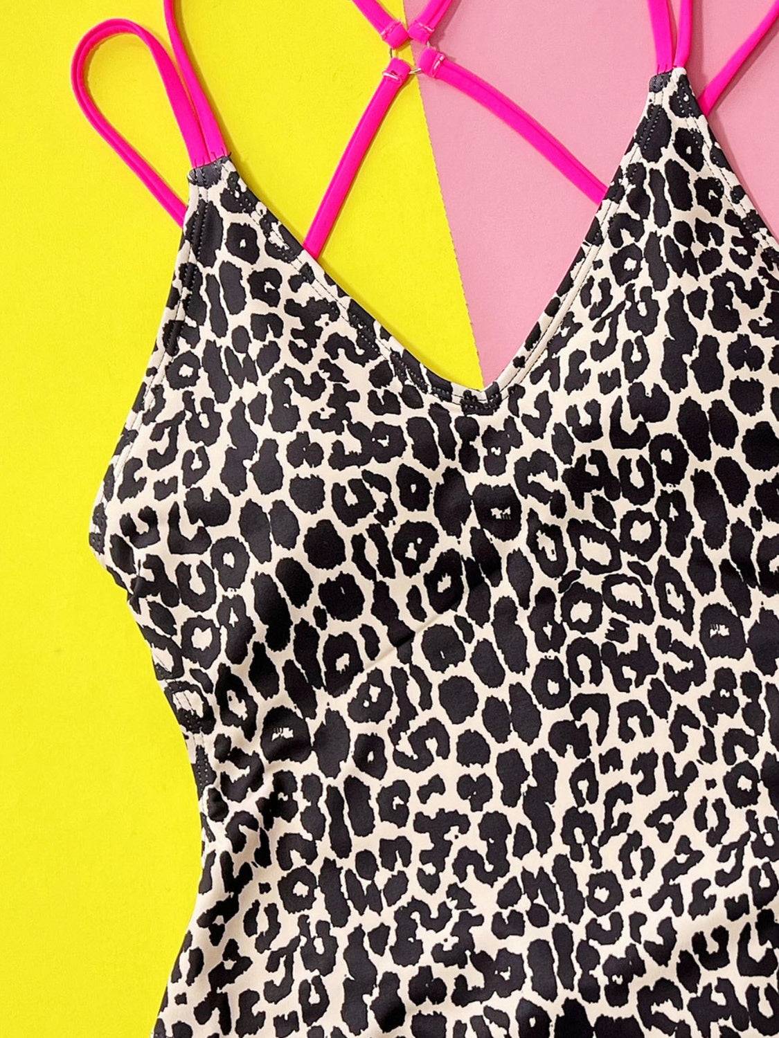 Close-up of leopard swimwear with pink straps