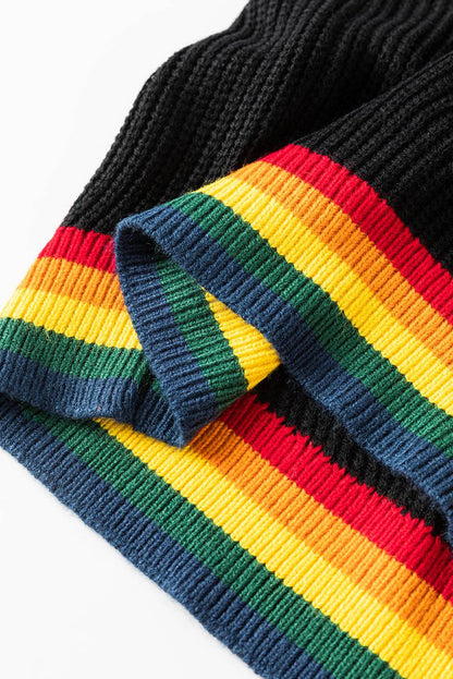 Close-up of black sweater hem with rainbow trim