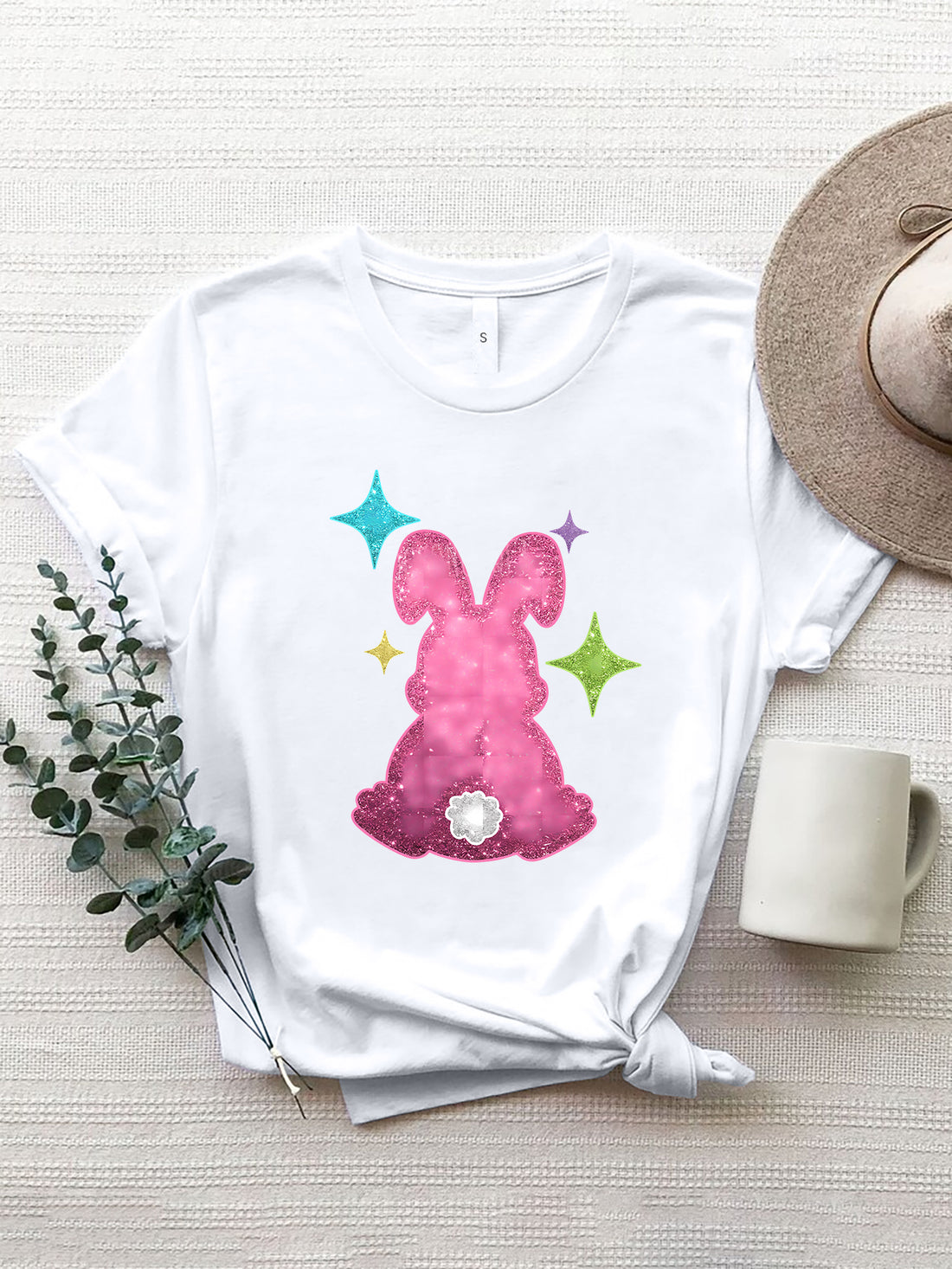 White T-shirt with pink rabbit design and colorful stars