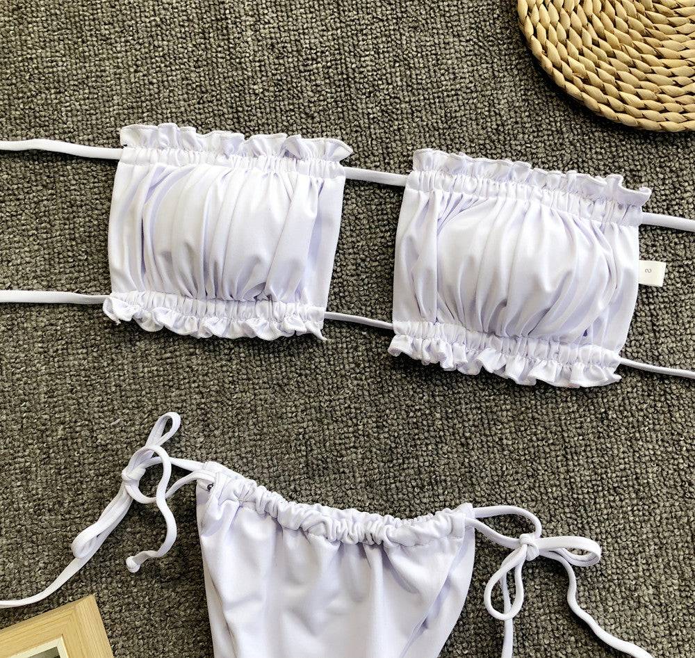 White frill trim ruched bikini set flat lay