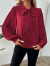 Burgundy blouse with pleated long sleeves and bow tie neck