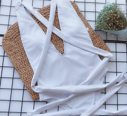 Close-up of white swimsuit ties