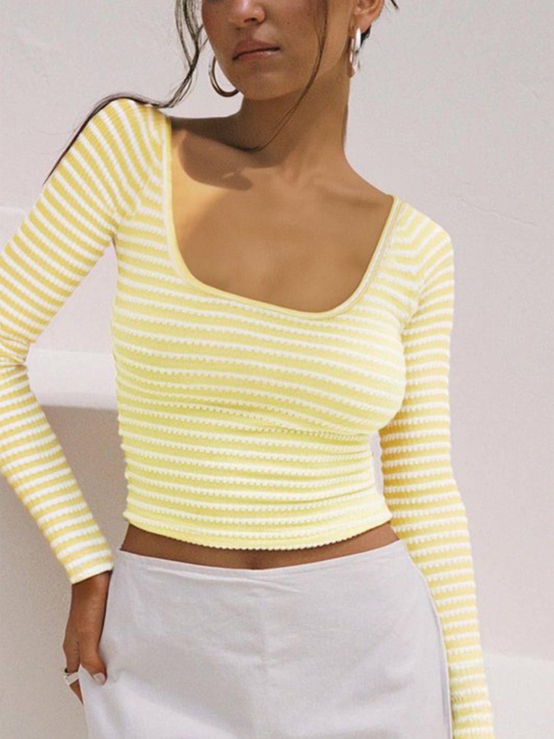 Model wearing yellow striped square neck long sleeve t-shirt