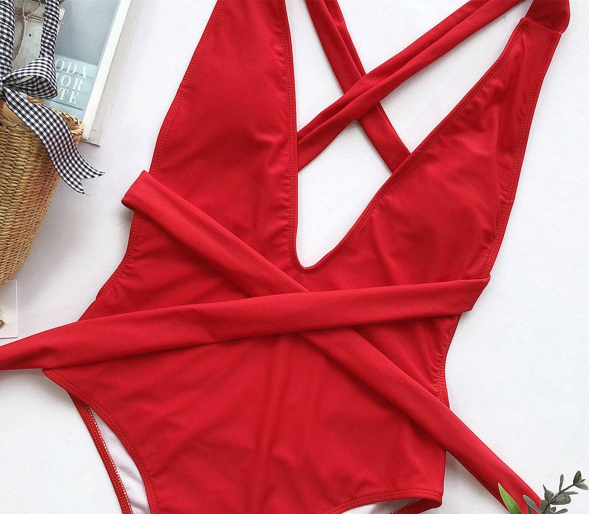 Flat lay of red tied one-piece swimsuit