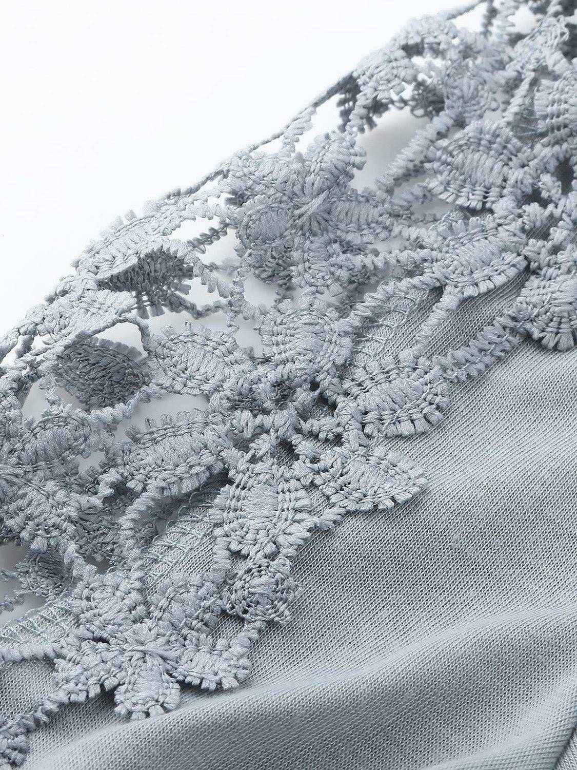 Close-up of lace details on gray long sleeve t-shirt