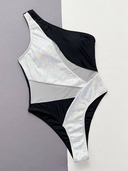 Black and silver contrast panel swimsuit flat lay