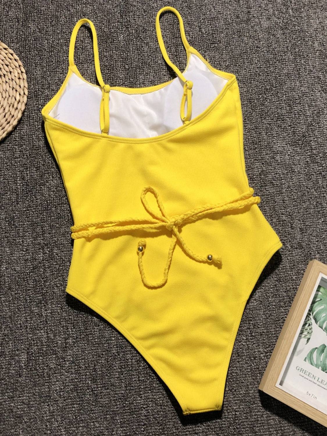 Yellow ribbed tie waist one-piece swimsuit flat lay