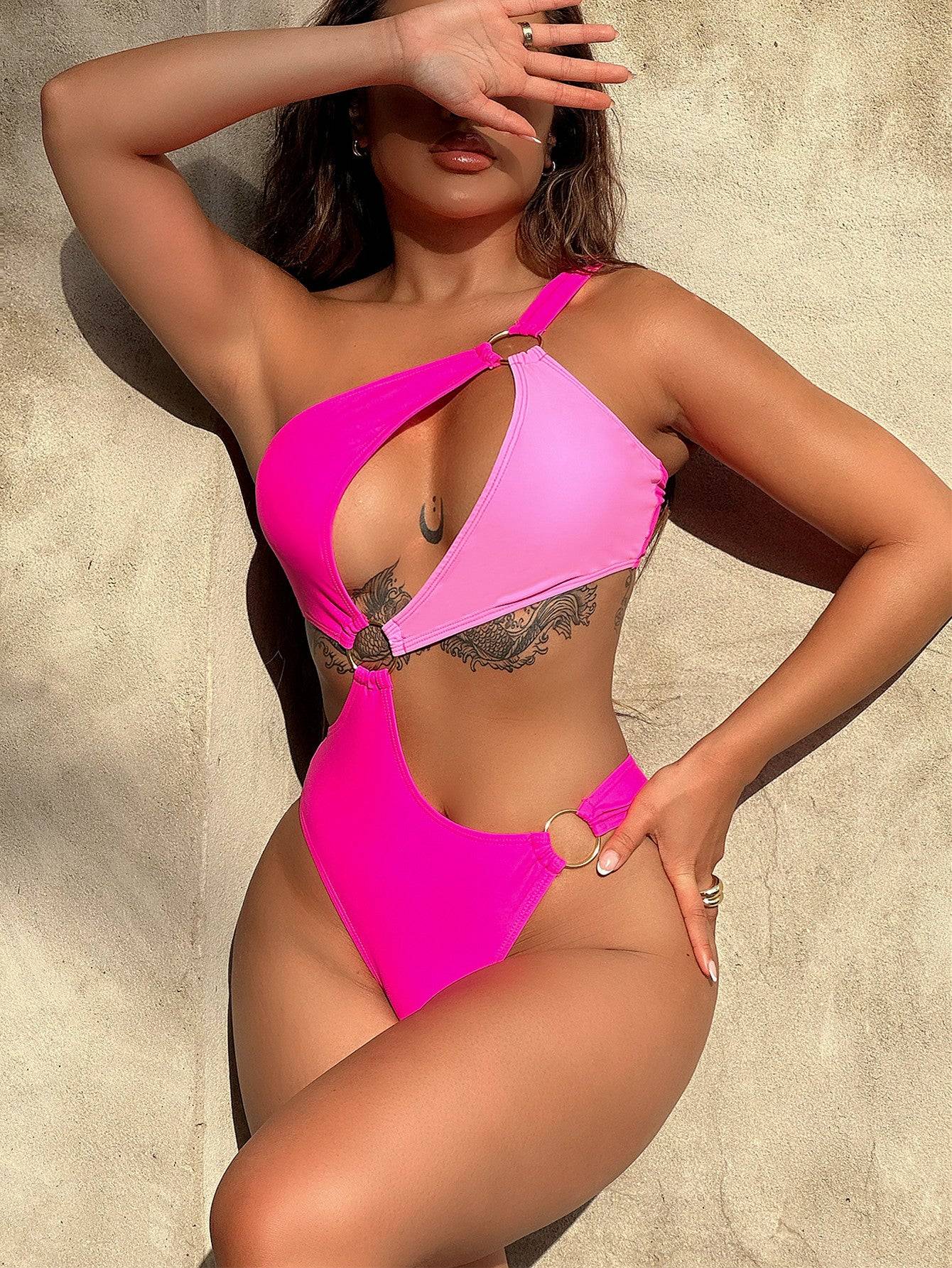 Pink one-shoulder cutout ring detail swimsuit front view