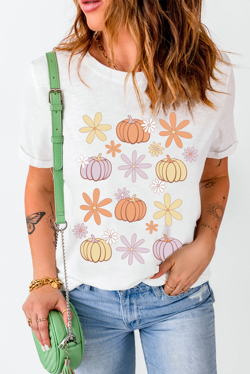 White T-Shirt featuring pumpkin and flower design.