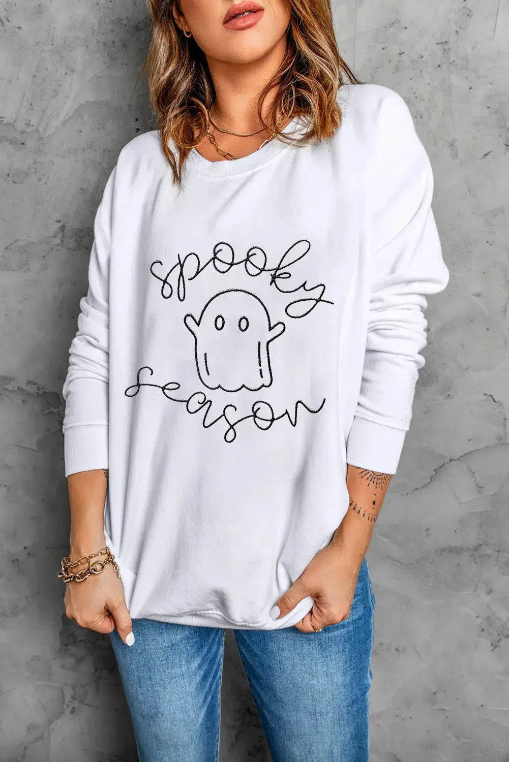 White sweatshirt with ghost graphic and &